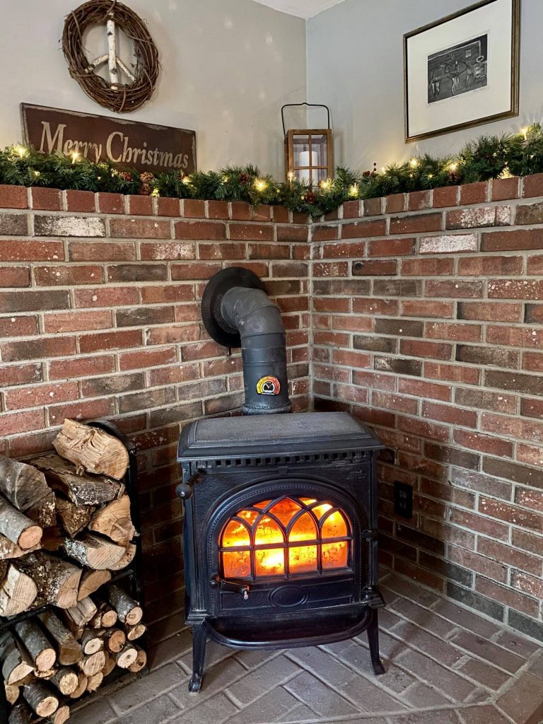 What a warm toasty "cape cod" wood stove corner. The mantle is so pretty and inviting. Thank you for sharing !